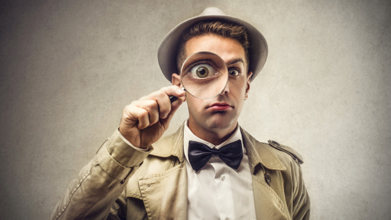 network detective with magnifying glass