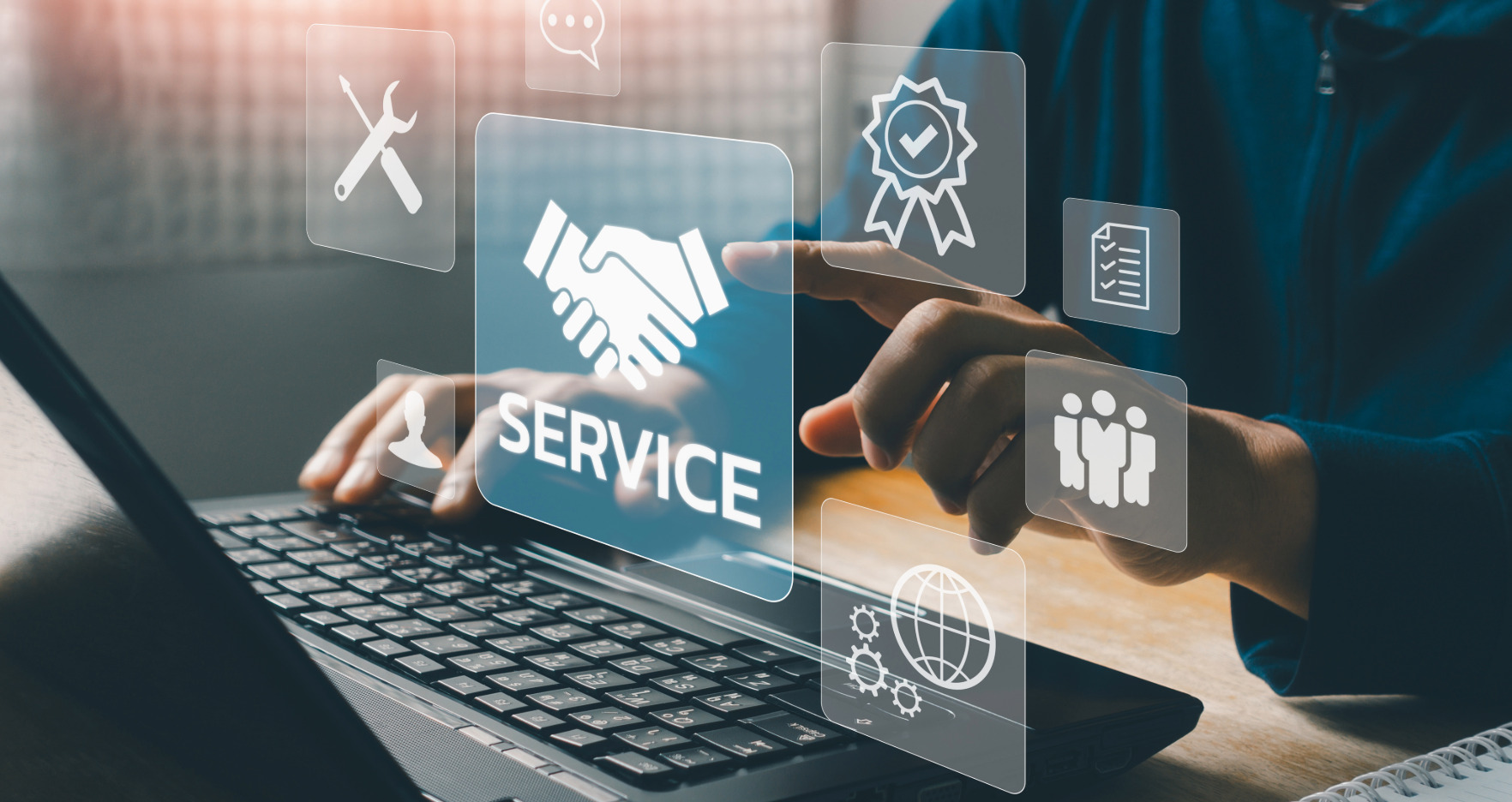 Person using a computer to provide IT and digital marketing service to business customers